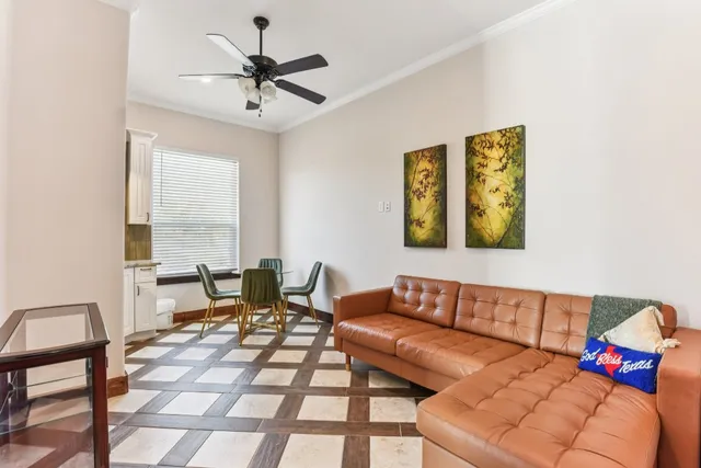 a living room with furniture and a window