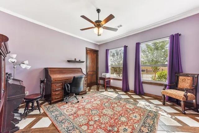 a living room with furniture a table and a large window