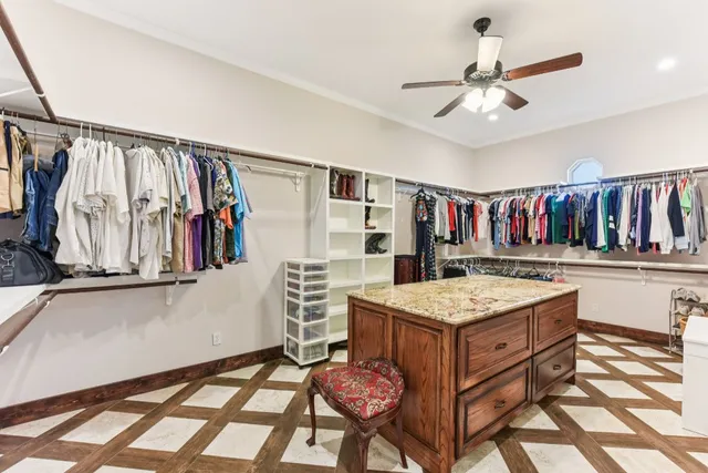 a kitchen that has a lot of cabinets in it