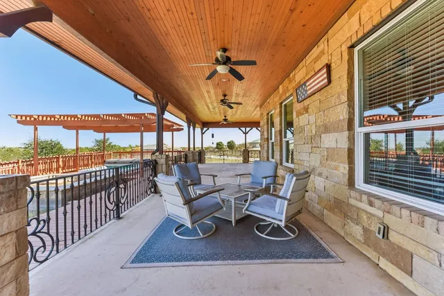 a view of a patio with a table chairs and a patio