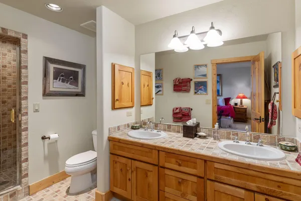a bedroom with furniture and a dresser