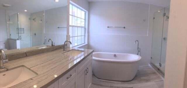10720 Bexley Boulevard Boca Raton, FL 33428 - Photo 14 of 29 a bathroom with a granite countertop sink a toilet and a bathtub