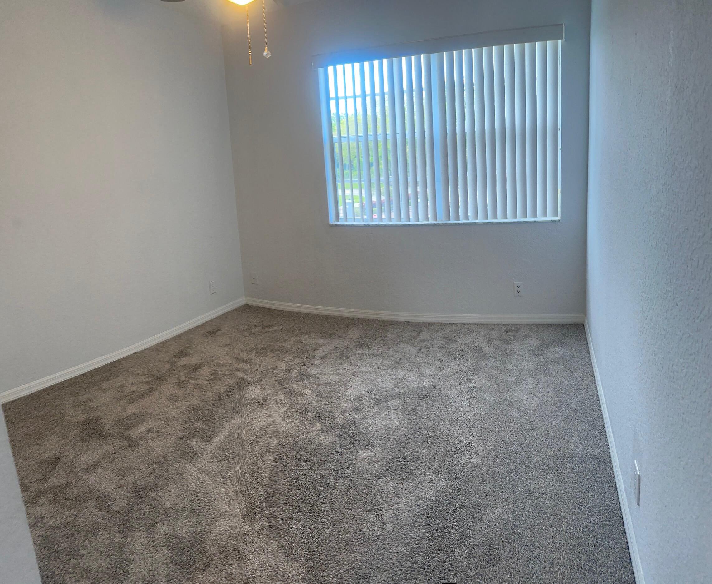 10720 Bexley Boulevard Boca Raton, FL 33428 - Photo 20 of 29 an empty room with a window