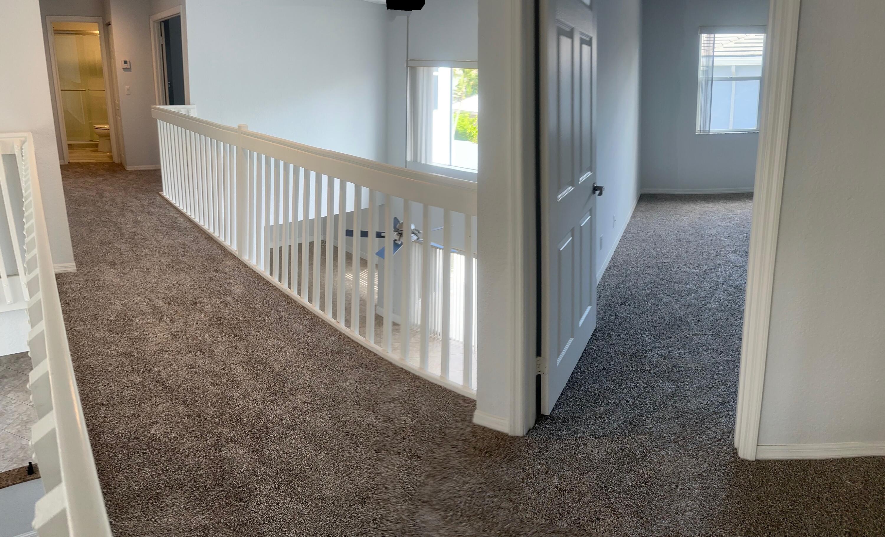 10720 Bexley Boulevard Boca Raton, FL 33428 - Photo 28 of 29 a view of a hallway view with staircase