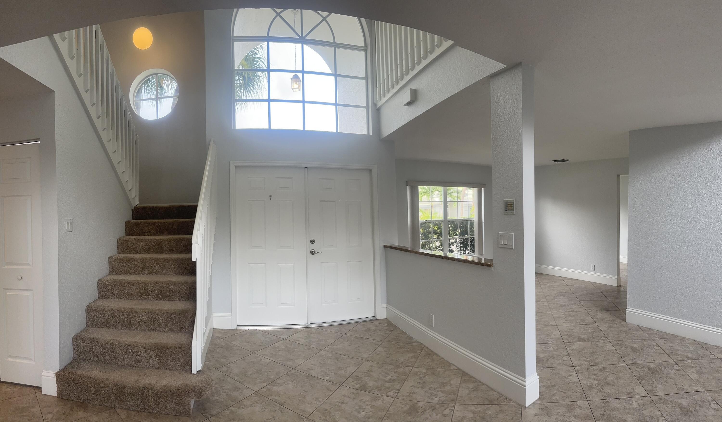 10720 Bexley Boulevard Boca Raton, FL 33428 - Photo 6 of 29 a view of an entryway with wooden floor