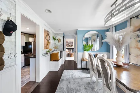 a living room with furniture fireplace and flat screen tv