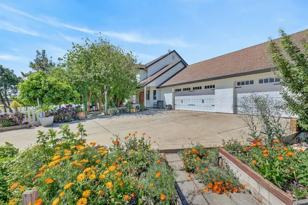 a kitchen with a refrigerator and a stove top oven