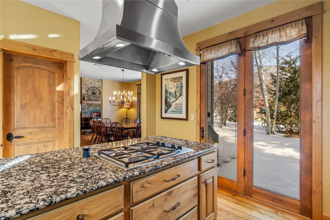3258 Snowflake Circle, Unit 2 Steamboat Springs, CO 80487 - Photo 14 of 45 a kitchen that has a stove and a table in it