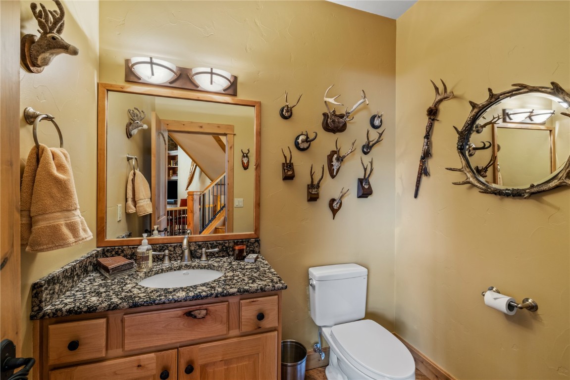 3258 Snowflake Circle, Unit 2 Steamboat Springs, CO 80487 - Photo 15 of 45 a bathroom with a granite countertop sink and a mirror