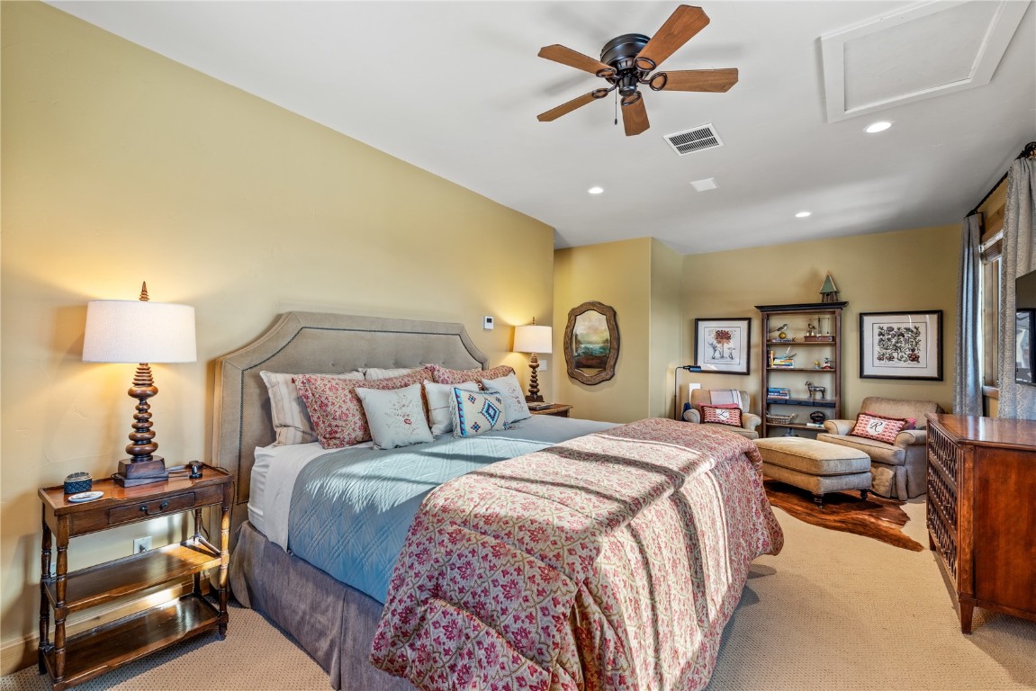 3258 Snowflake Circle, Unit 2 Steamboat Springs, CO 80487 - Photo 16 of 45 a bedroom with a bed and a chandelier