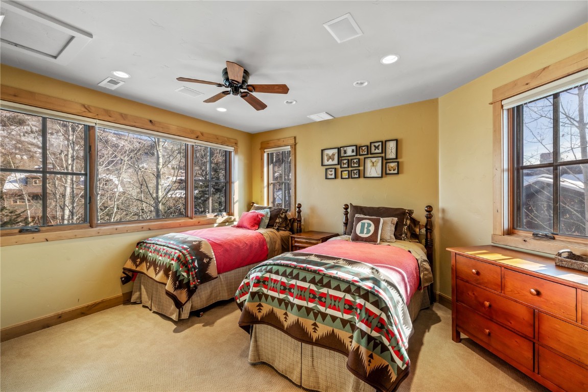 3258 Snowflake Circle, Unit 2 Steamboat Springs, CO 80487 - Photo 31 of 45 a bedroom with two beds and a large window