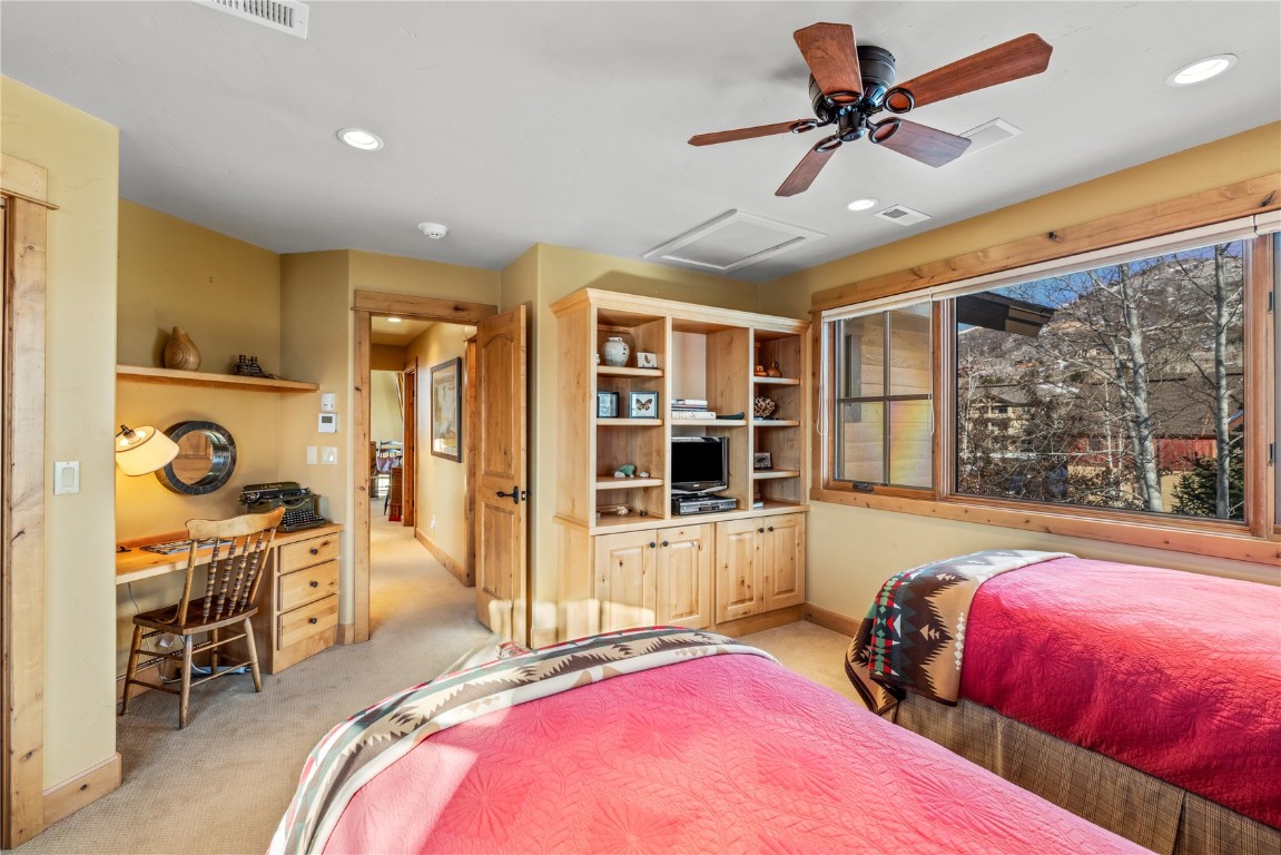 3258 Snowflake Circle, Unit 2 Steamboat Springs, CO 80487 - Photo 32 of 45 a bed room with a bed and a tv