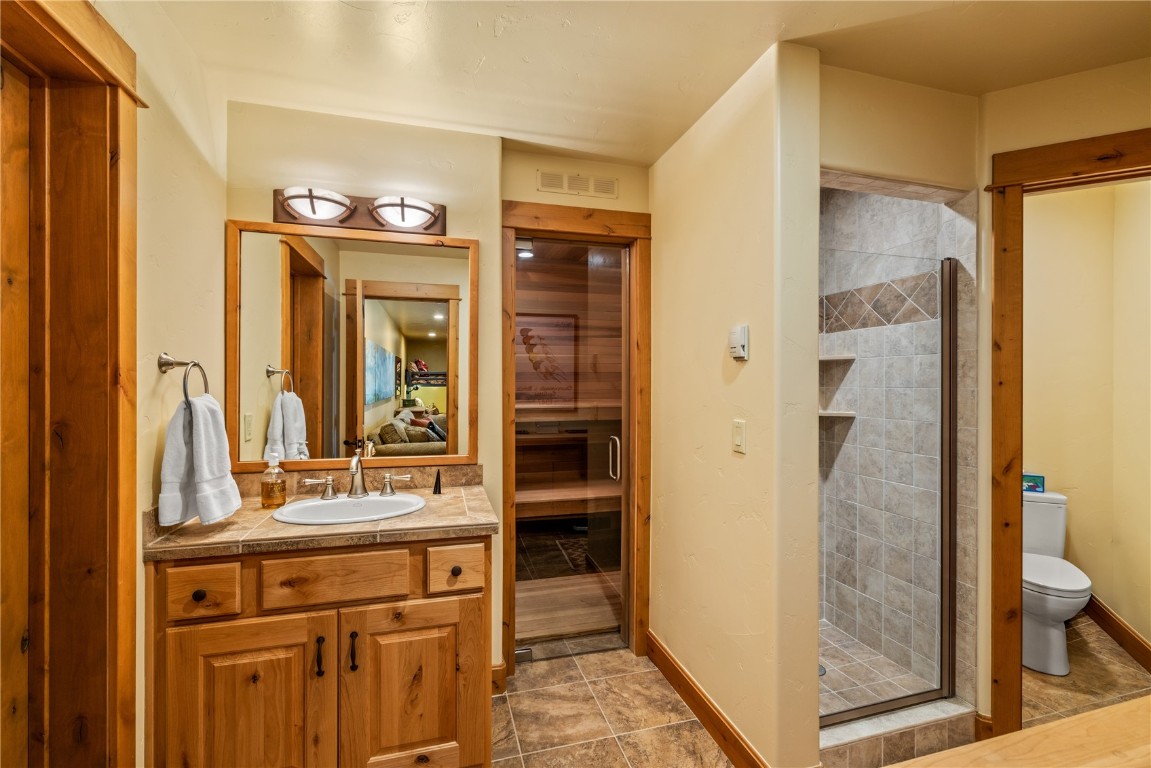 3258 Snowflake Circle, Unit 2 Steamboat Springs, CO 80487 - Photo 36 of 45 a bathroom with a sink and a mirror
