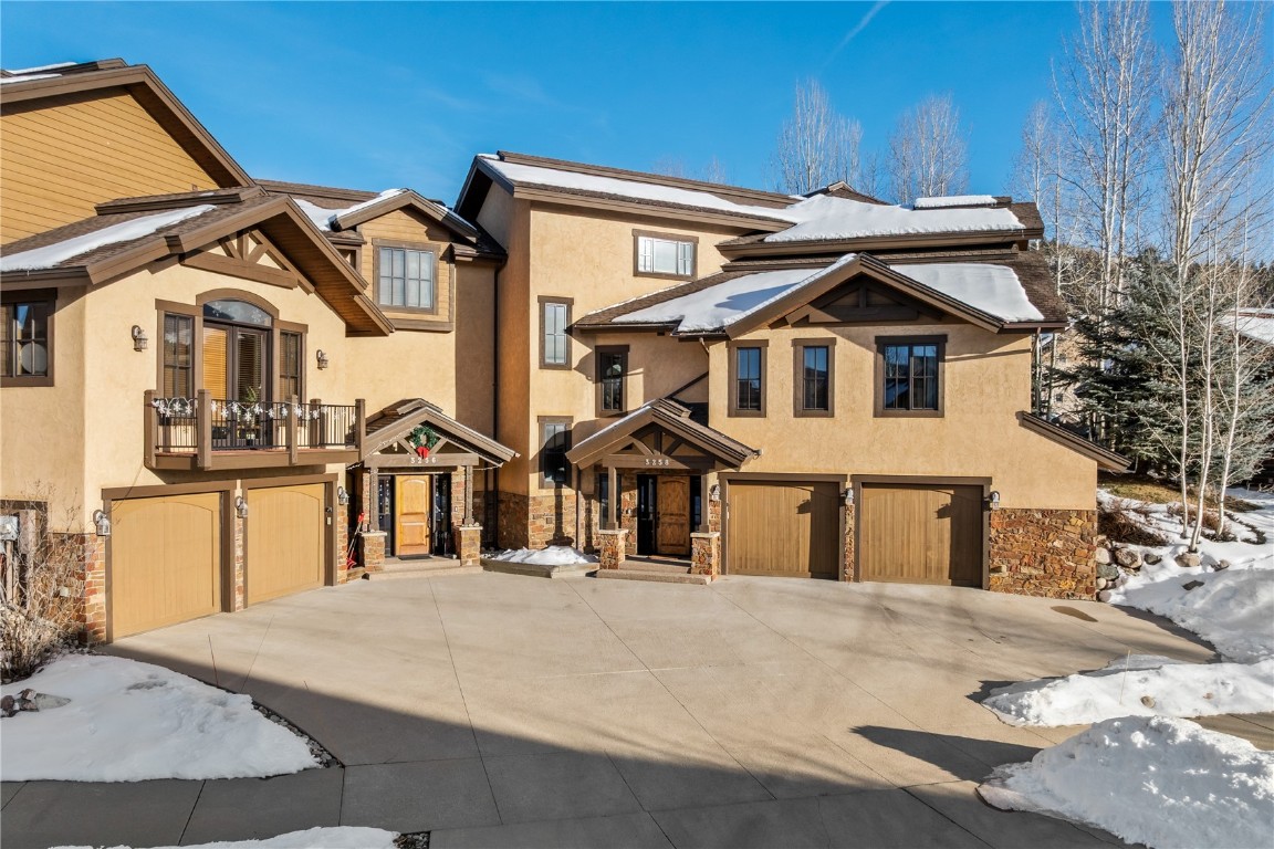 3258 Snowflake Circle, Unit 2 Steamboat Springs, CO 80487 - Photo 40 of 45 a front view of a house with a yard