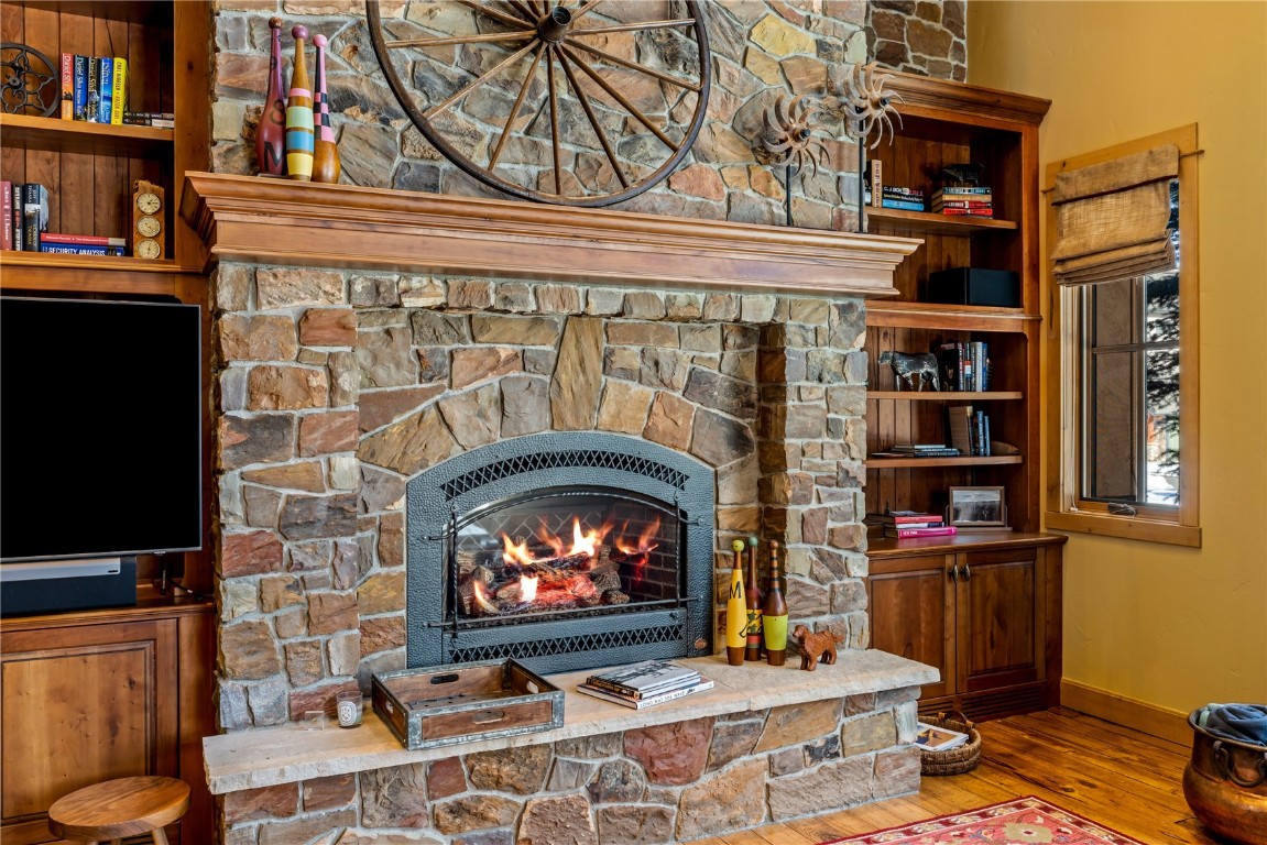 3258 Snowflake Circle, Unit 2 Steamboat Springs, CO 80487 - Photo 6 of 45 a living room with a fireplace and a flat screen tv