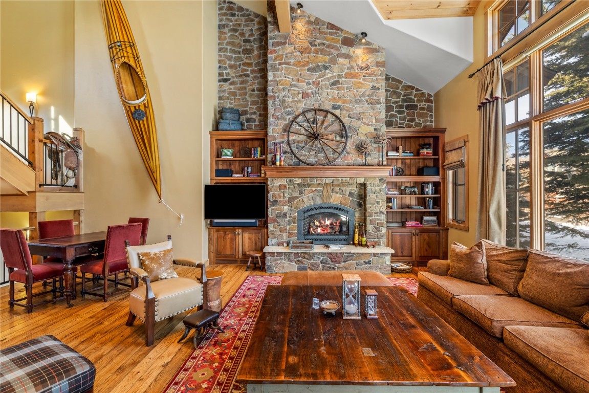 3258 Snowflake Circle, Unit 2 Steamboat Springs, CO 80487 - Photo 7 of 45 a living room with furniture and a fireplace