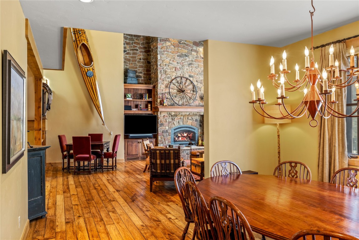 3258 Snowflake Circle, Unit 2 Steamboat Springs, CO 80487 - Photo 9 of 45 a dining room with furniture and wooden floor