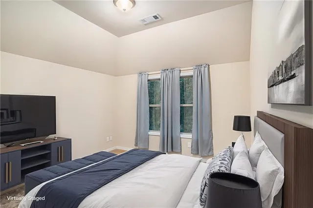 an empty room with windows and closet