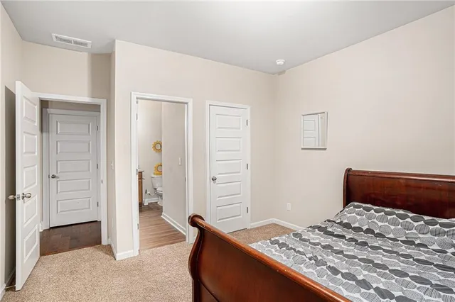 a bathroom with a sink a toilet and shower curtain