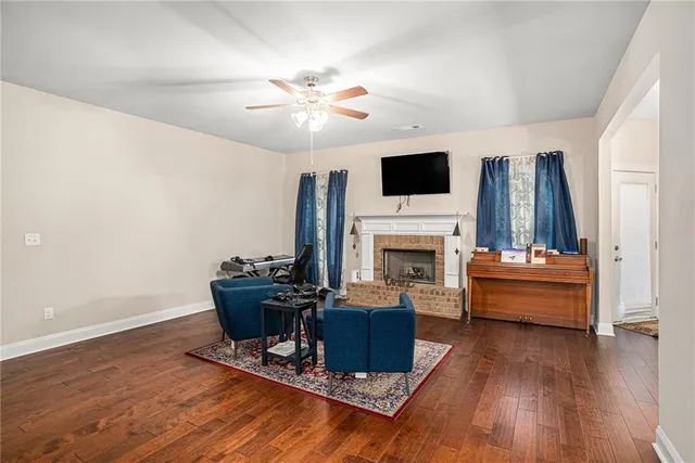 a living room with furniture fireplace and flat screen tv