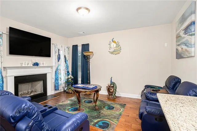 a living room with furniture fireplace and flat screen tv