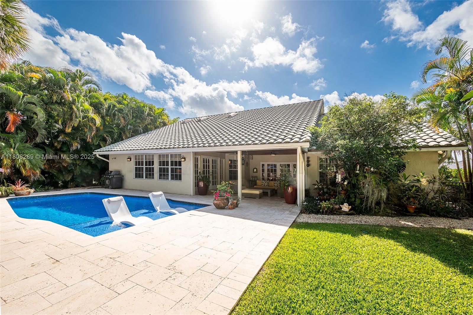 2215 Southwest 14th Place Boca Raton, FL 33486 - Photo 54 of 77 a front view of a house with yard patio and green space