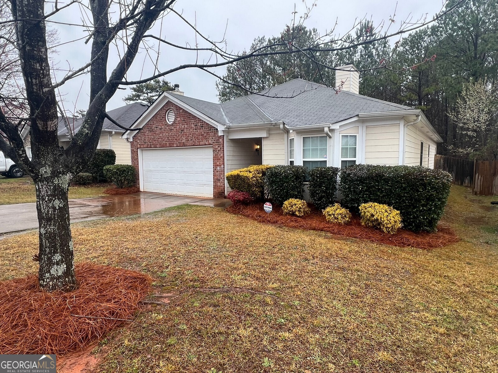 165 Lakeside Point Covington, GA 30016 - Photo 21 of 26 a front view of a house with a yard and garage