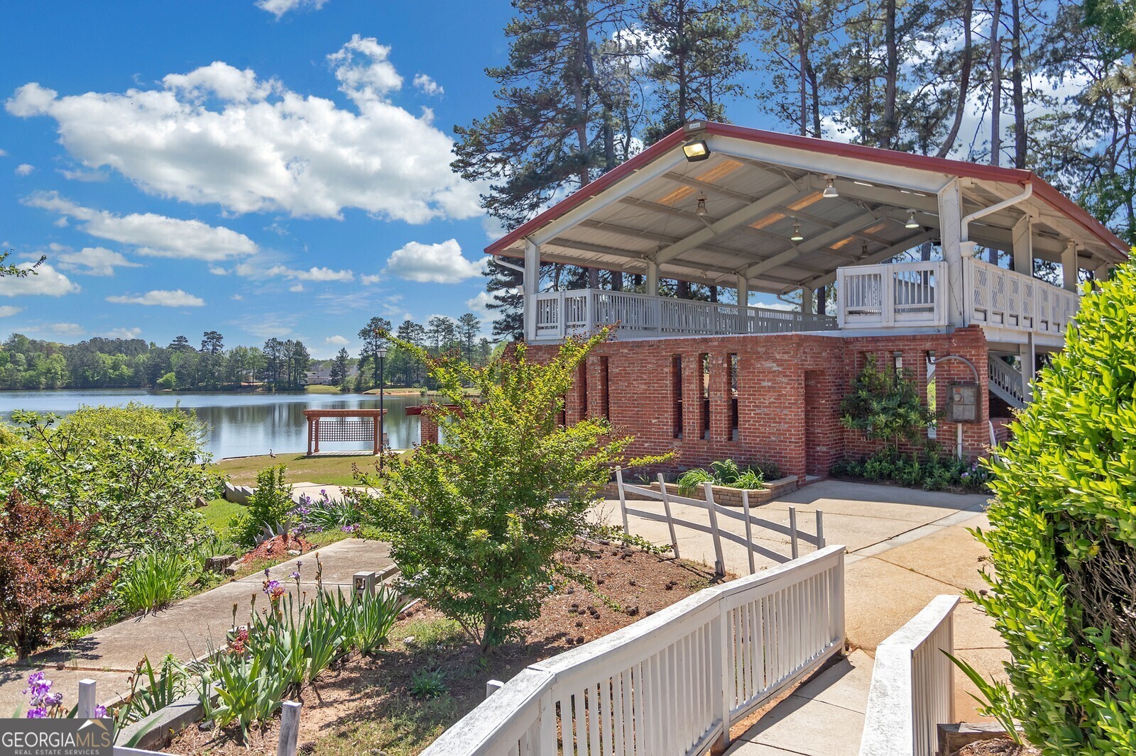 165 Lakeside Point Covington, GA 30016 - Photo 23 of 26 a view of a chair and tables in the balcony