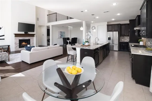 a living room with fireplace furniture and a flat screen tv