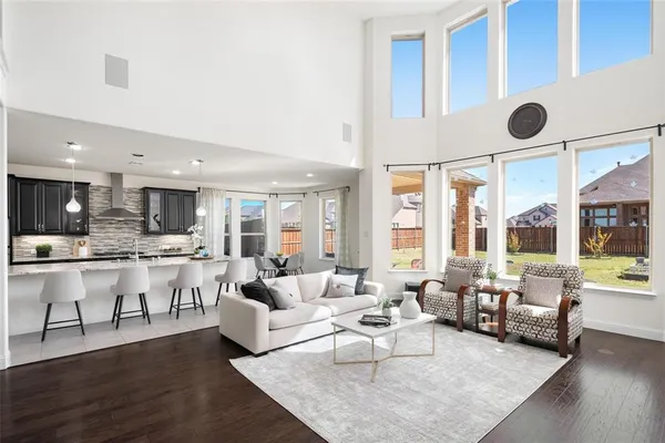 a living room with lots of furniture and view of living room