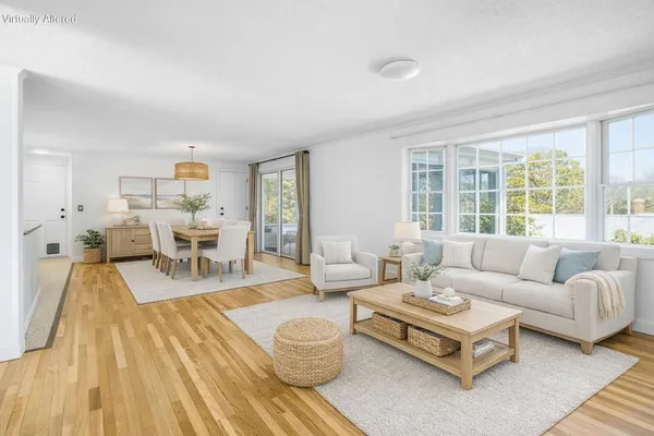 a living room with furniture and a table