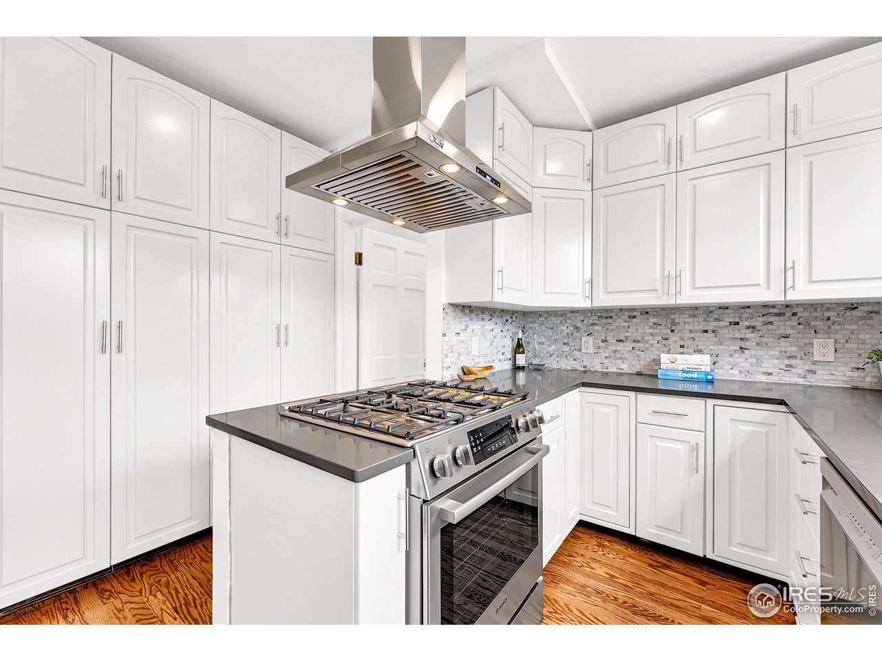 1741 Pine Street Boulder, CO 80302 - Photo 15 of 38 a kitchen with cabinets and stainless steel appliances