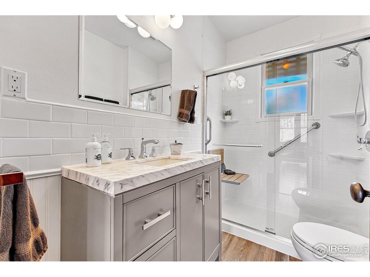 1741 Pine Street Boulder, CO 80302 - Photo 17 of 38 a bathroom with a sink toilet a mirror and shower