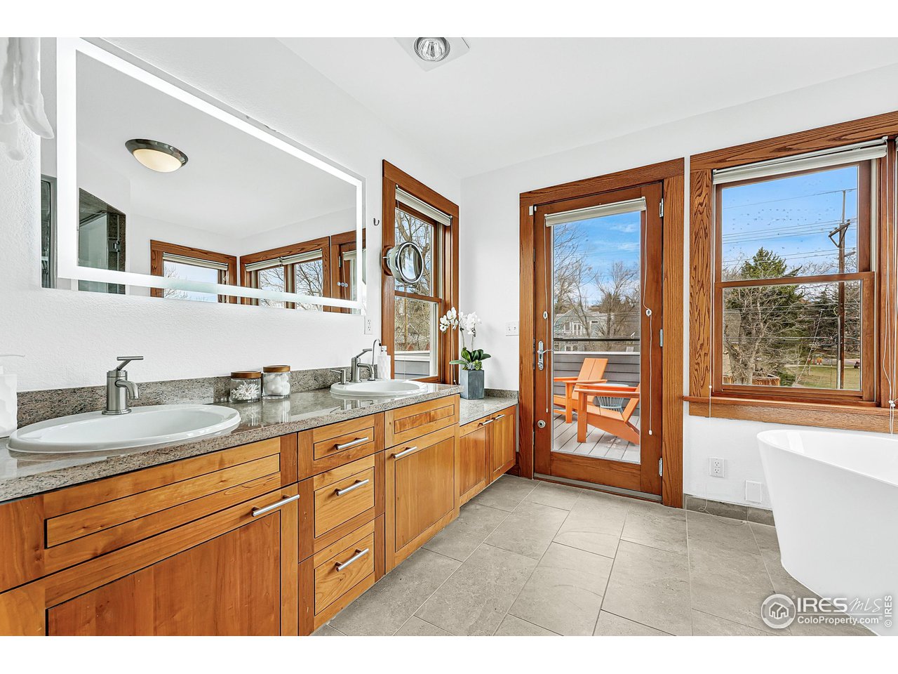 1741 Pine Street Boulder, CO 80302 - Photo 26 of 38 a large bathroom with a granite countertop double vanity next to a window