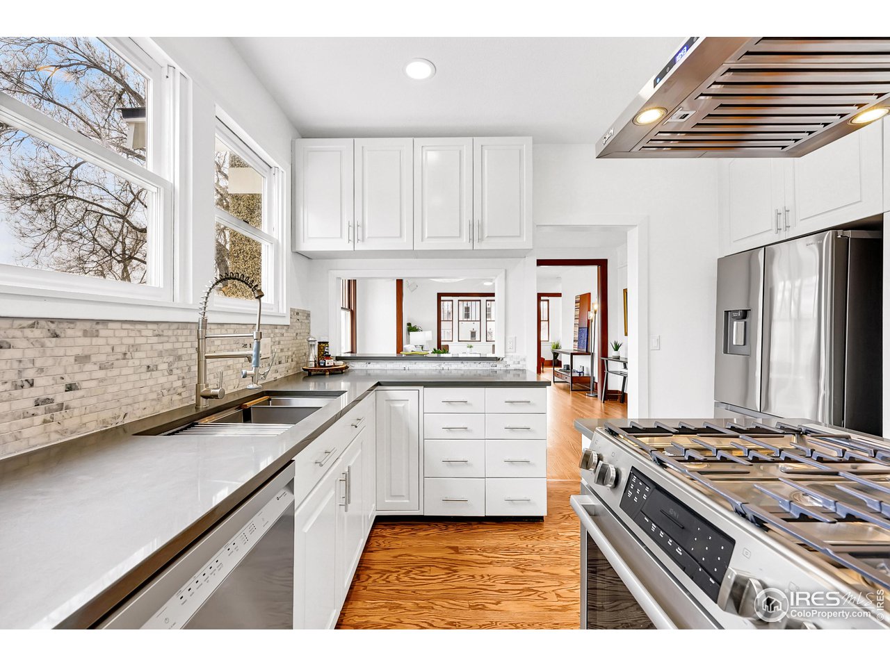 1741 Pine Street Boulder, CO 80302 - Photo 3 of 38 a kitchen with stainless steel appliances a stove a sink and a refrigerator