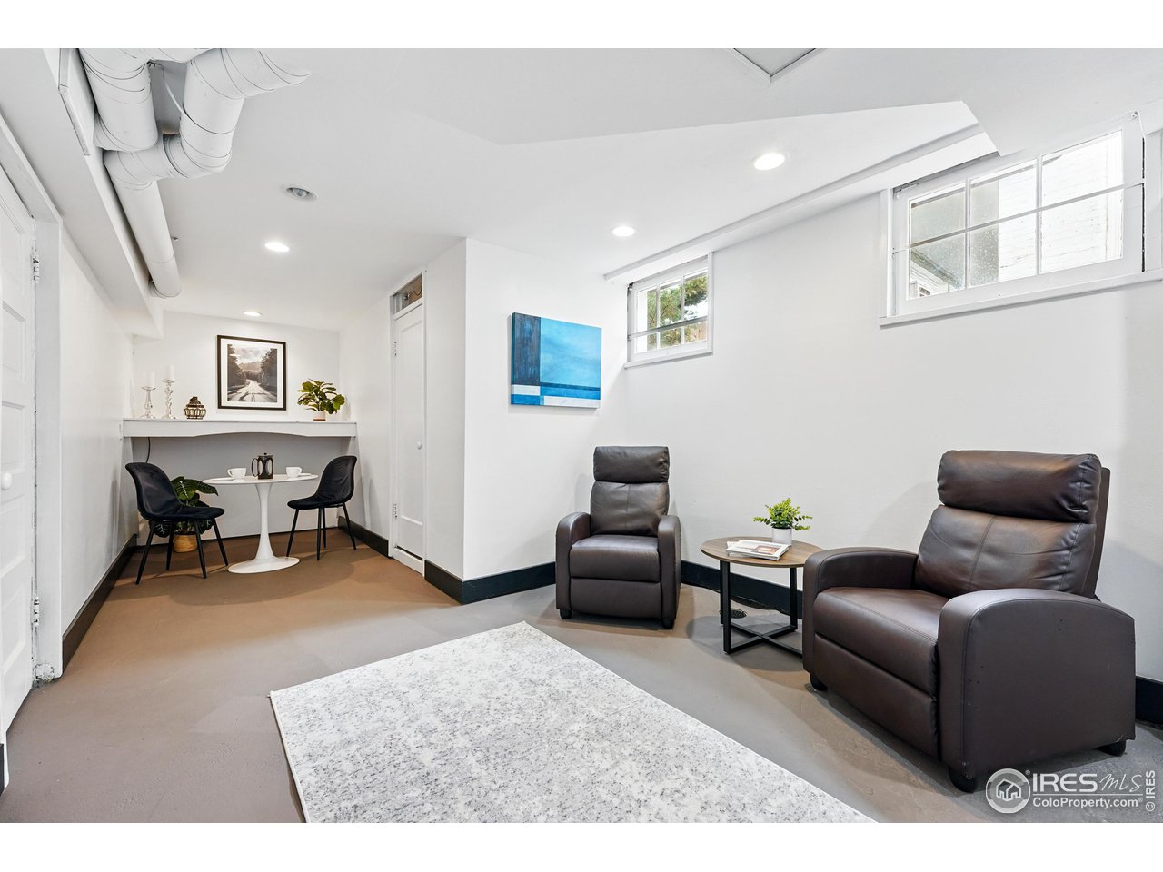 1741 Pine Street Boulder, CO 80302 - Photo 32 of 38 a living room with furniture and a wooden floor
