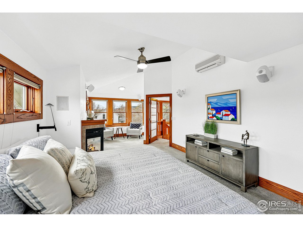 1741 Pine Street Boulder, CO 80302 - Photo 4 of 38 a bedroom with furniture and a flat screen tv