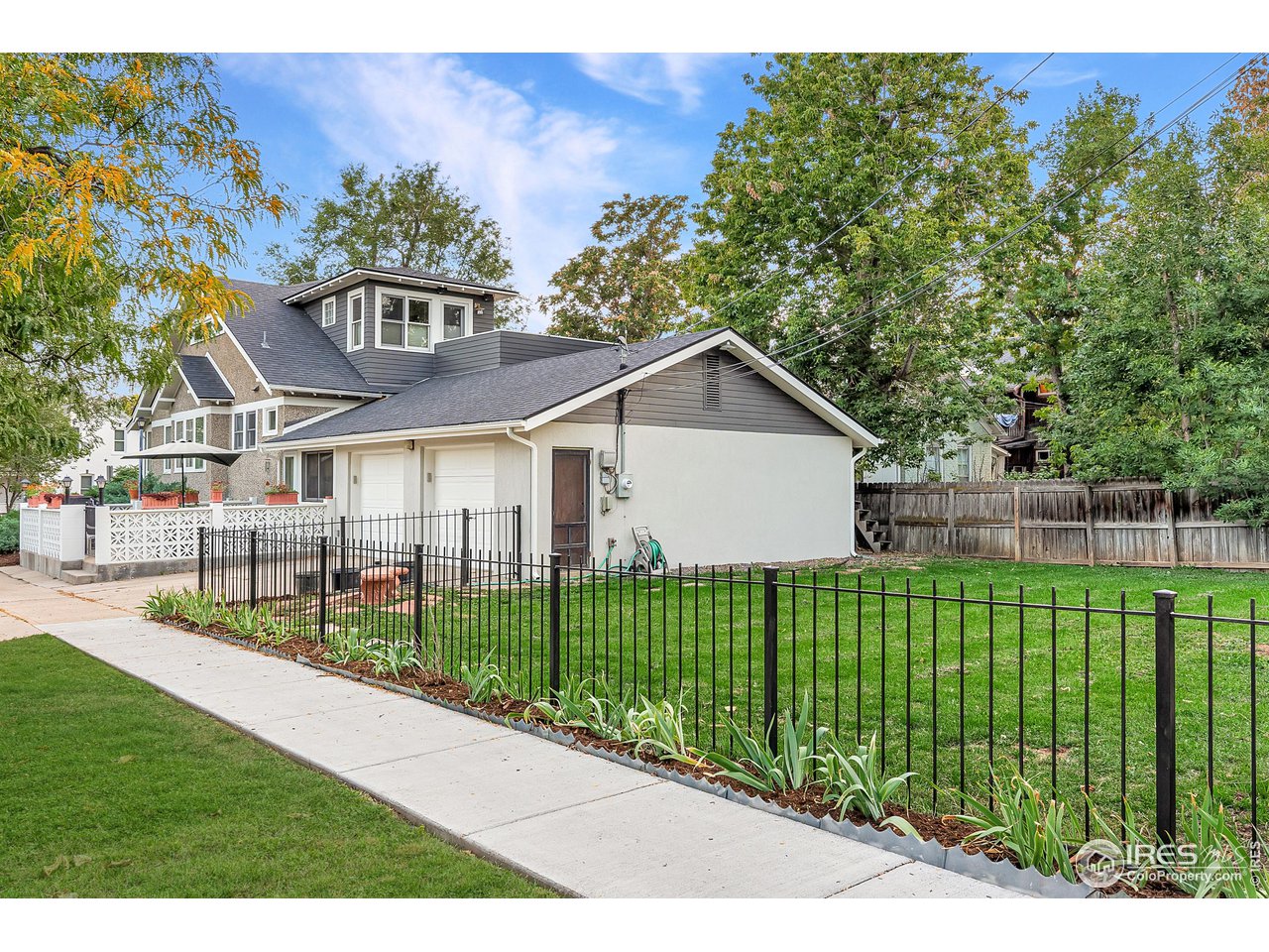 1741 Pine Street Boulder, CO 80302 - Photo 6 of 38 a view of a house with a yard and potted plants