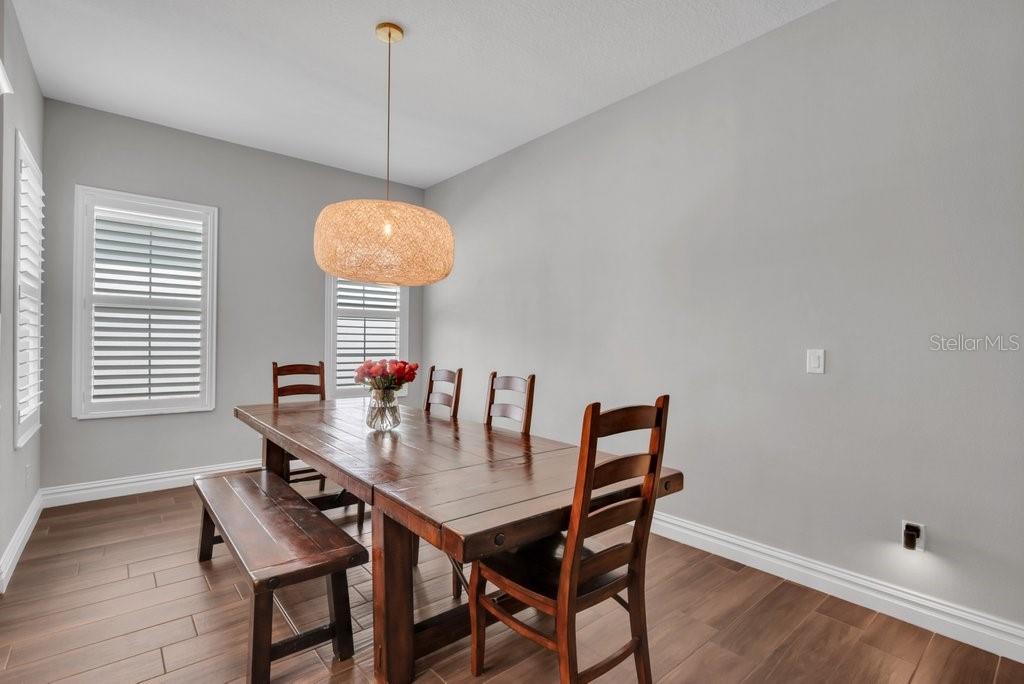 14908 Bassinger Lane Lithia, FL 33547 - Photo 16 of 56 a dining room with furniture and window