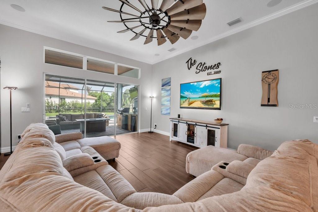 14908 Bassinger Lane Lithia, FL 33547 - Photo 17 of 56 a living room with furniture and a large window
