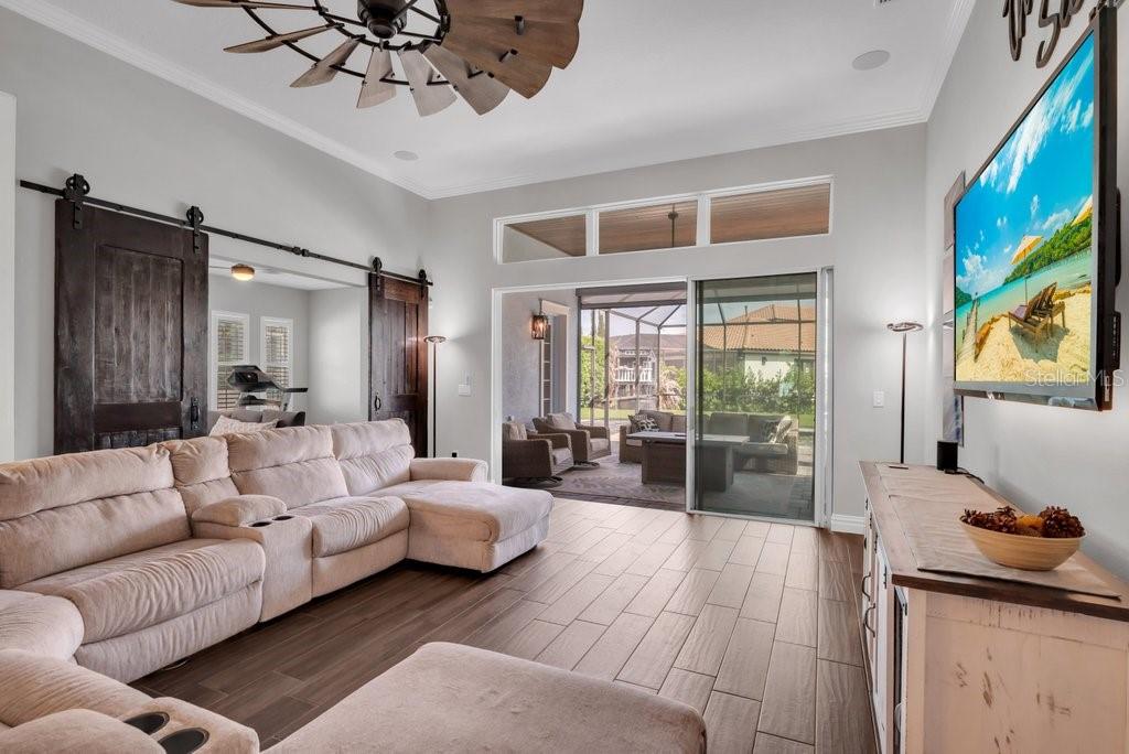 14908 Bassinger Lane Lithia, FL 33547 - Photo 18 of 56 a living room with furniture and a large window