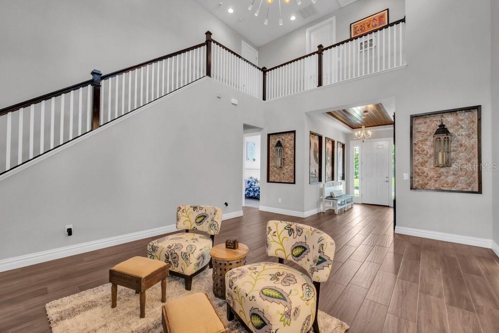 14908 Bassinger Lane Lithia, FL 33547 - Photo 28 of 56 a living room with furniture and wooden floor