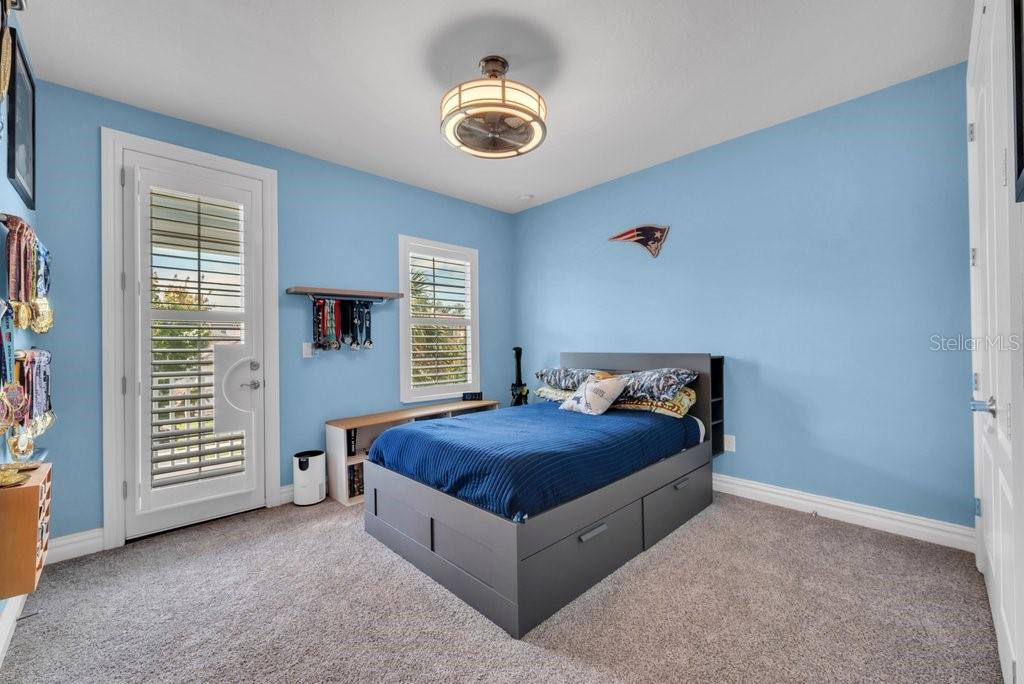14908 Bassinger Lane Lithia, FL 33547 - Photo 34 of 56 a bedroom with a bed and a window