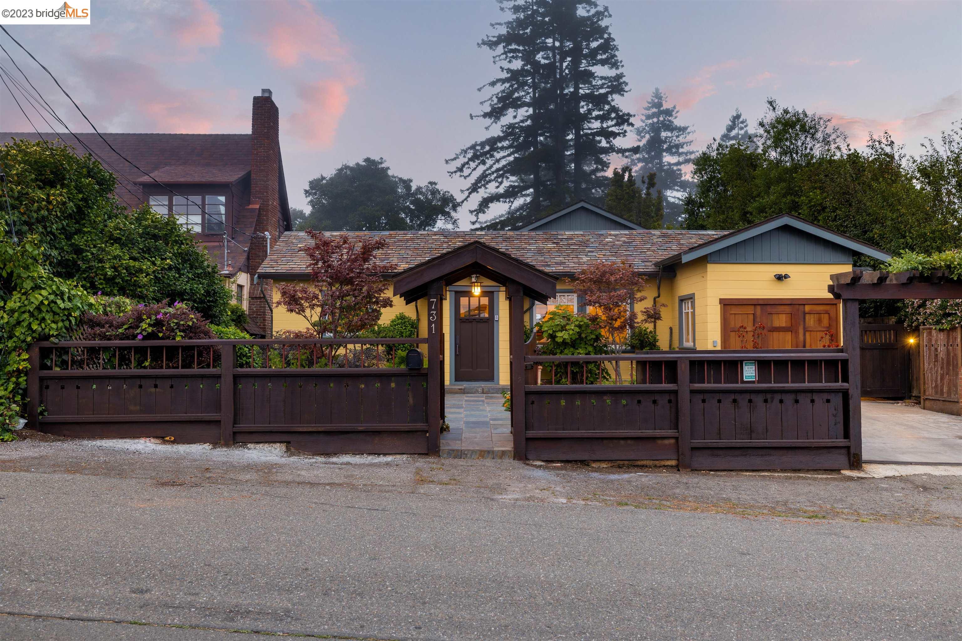 a view of a house with a yard and furniture