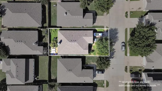 an aerial view of houses with outdoor space