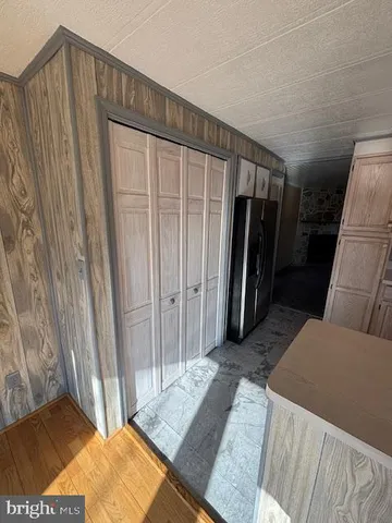 a bed room with a bed and a mirror