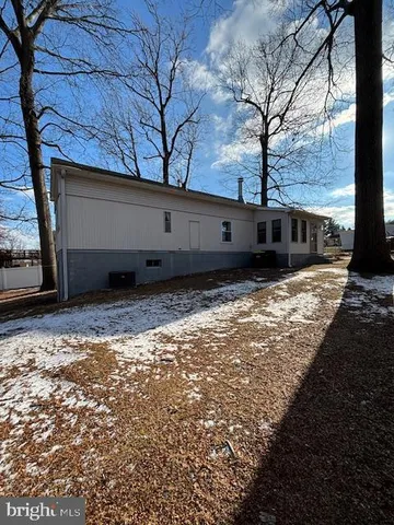 a view of a backyard of the house