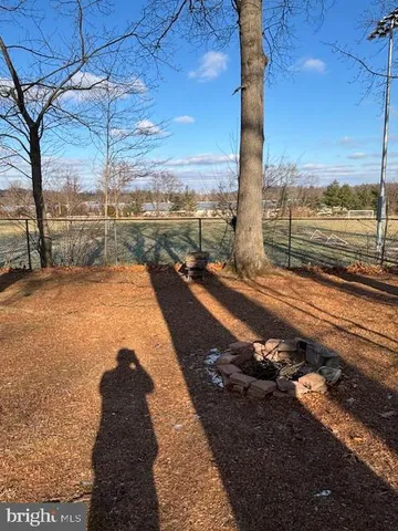 a view of swimming pool with outdoor seating