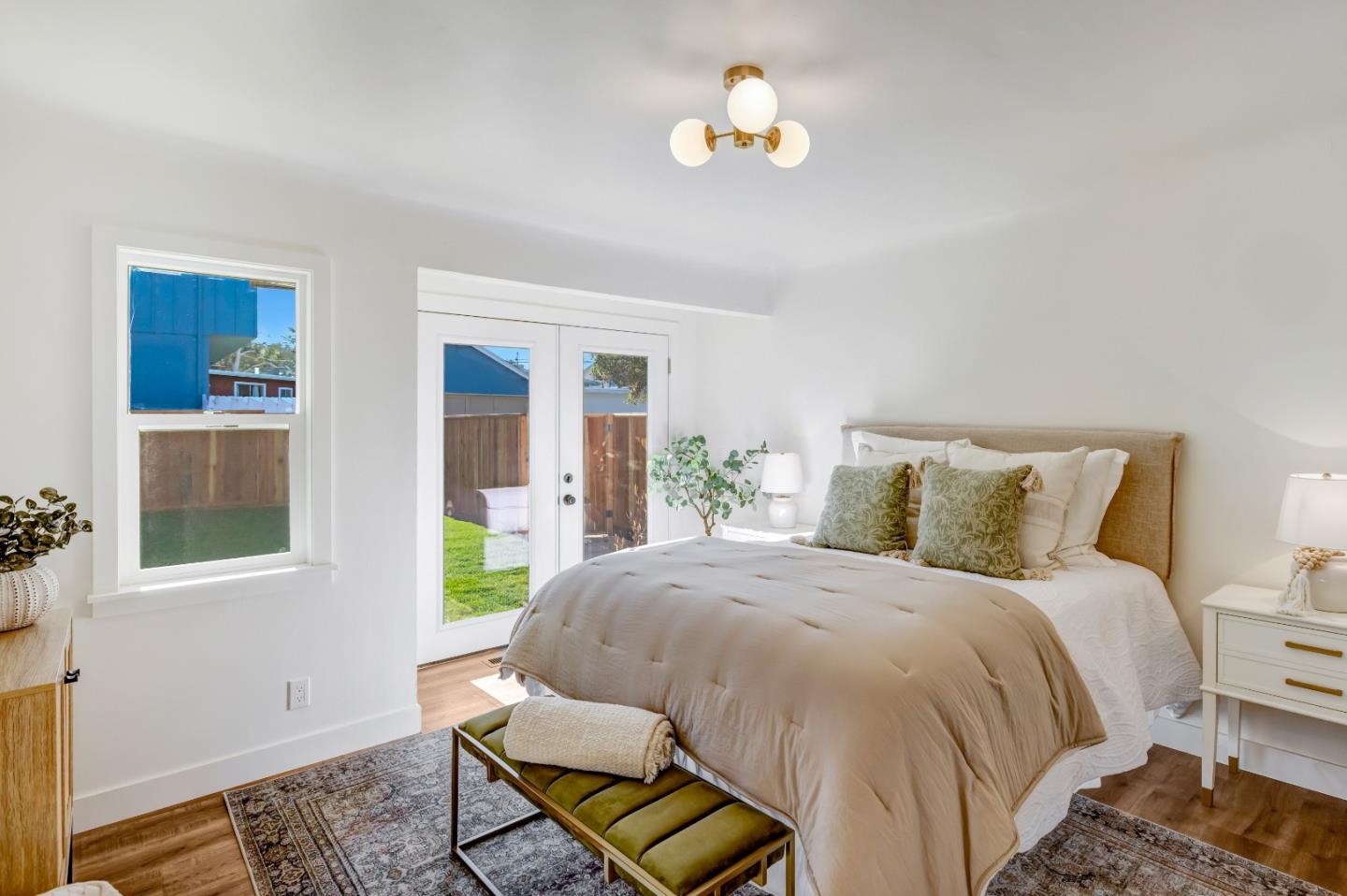 508 4th Street Pacific Grove, CA 93950 - Photo 11 of 20 a bedroom with a bed and a window