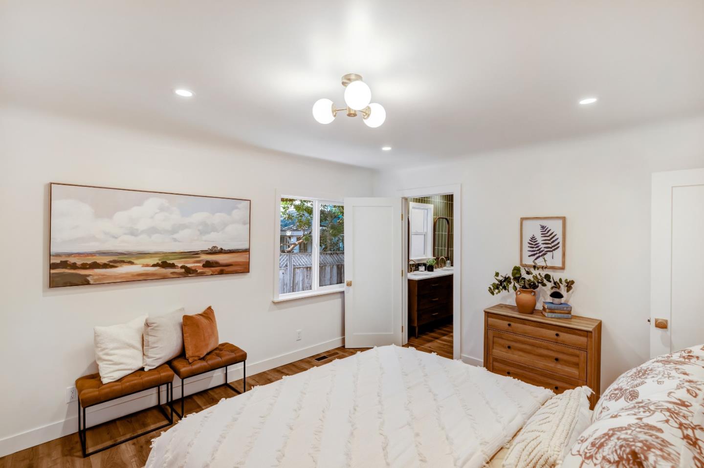 508 4th Street Pacific Grove, CA 93950 - Photo 14 of 20 a bedroom with a bed and wooden floor